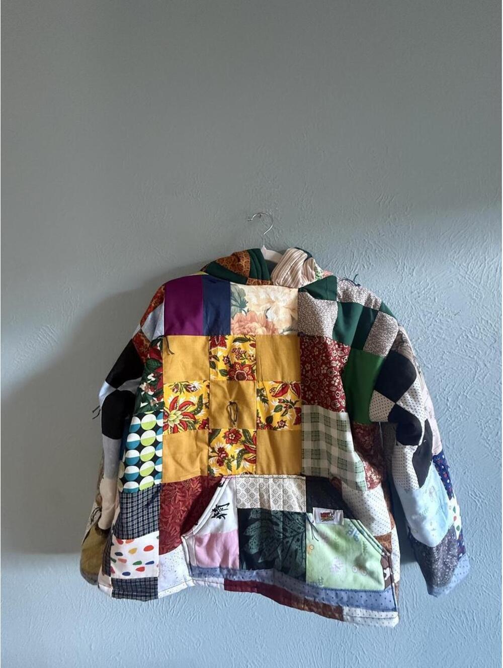 Handmade upcycled quilt hoodie sweatshirt with floral, geometric, and polka dot